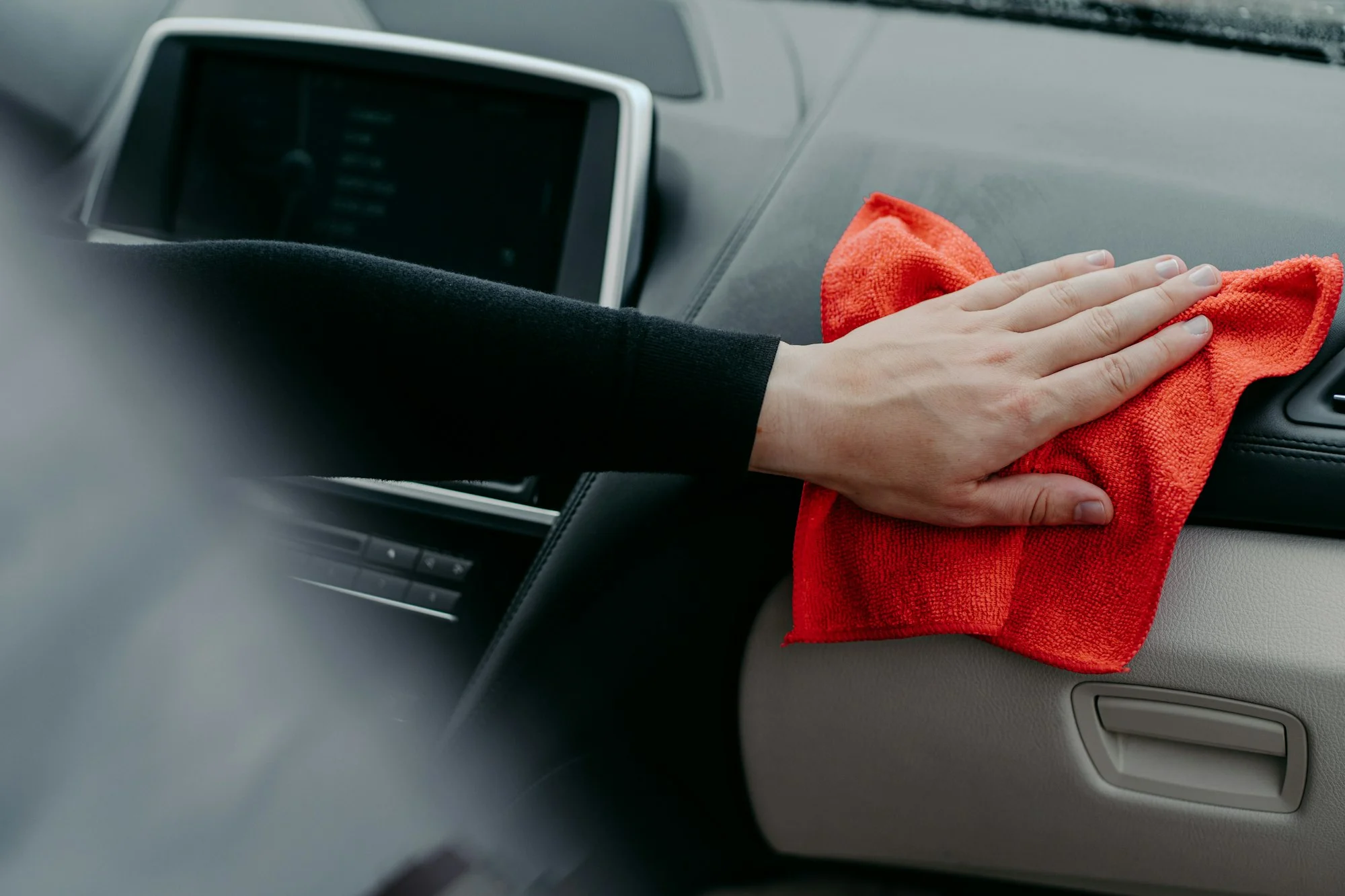 Disinfection and cleaning concept. Killing coronavirus on touching surface of auto